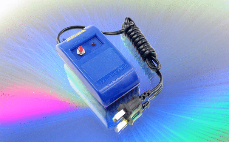 A blue electric watch demagnetizer tool with a red power button and coiled power cord, used for repairing magnetized mechanical watches.
